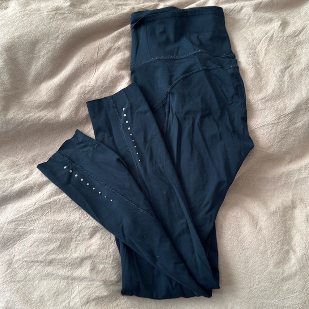 Teal Lululemon leggings with pockets
